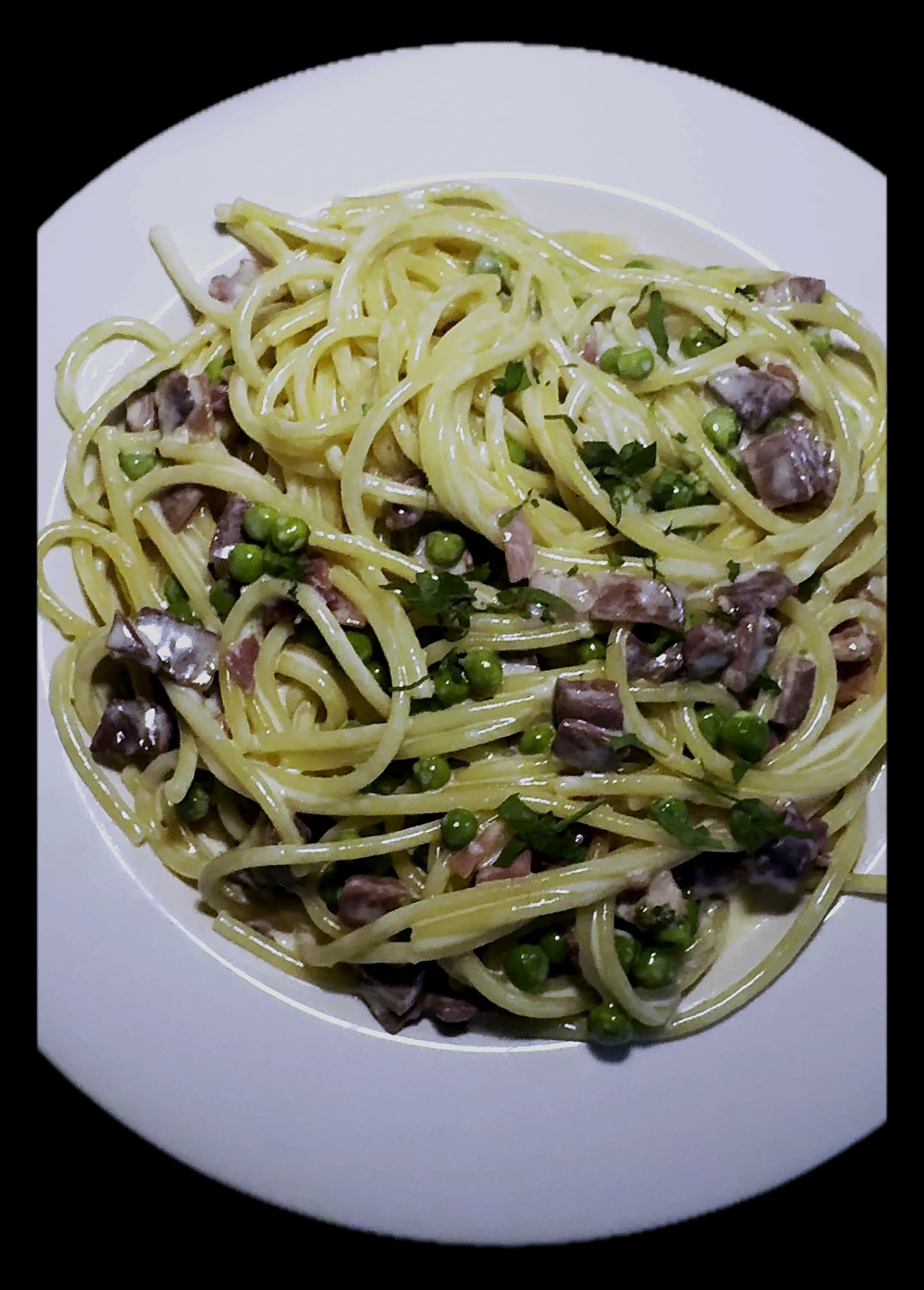 Carbonara — spaghetti with pancetta, sweet peas and cream