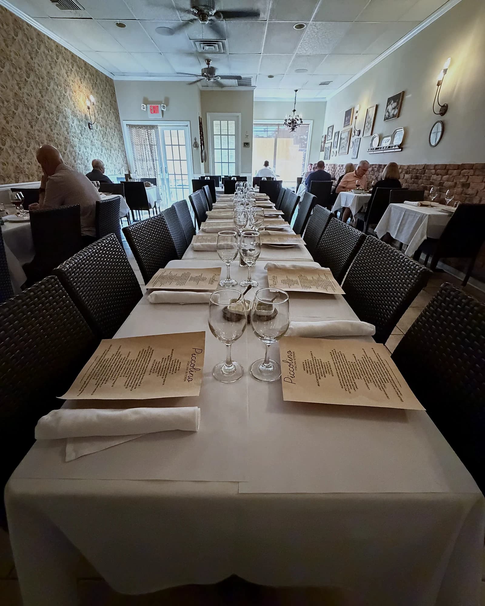 The dining room at Piccolino, tables set with white linens